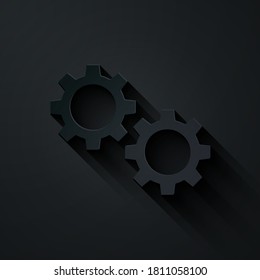 Paper cut Gear icon isolated on black background. Cogwheel gear settings sign. Cog symbol. Paper art style. Vector.