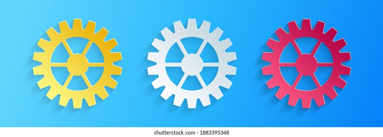Paper cut Gear icon isolated on blue background. Cogwheel gear settings sign. Cog symbol. Paper art style. Vector.