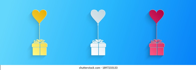 Paper cut Gift with balloon in shape of heart icon isolated on blue background. Valentine's day, wedding, birthday card. Paper art style. Vector.