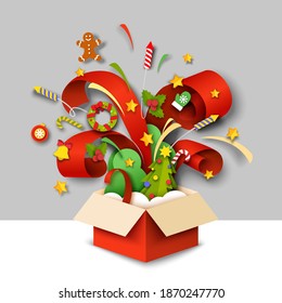 Paper cut gift box with Christmas symbols. Vector illustration in paper art craft style. Open magic box with Christmas tree, wreath, ball, bell, holly berry, mitten, fireworks, candy cane.