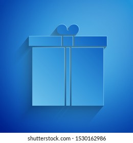 Paper cut Gift box icon isolated on blue background. Paper art style. Vector Illustration