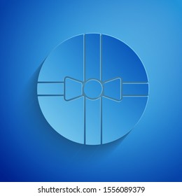 Paper cut Gift box icon isolated on blue background. Merry Christmas and Happy New Year. Paper art style. Vector Illustration