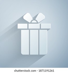 Paper cut Gift box icon isolated on grey background. Merry Christmas and Happy New Year. Paper art style. Vector
