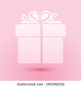 Paper cut Gift box icon isolated on pink background. Paper art style. Vector.