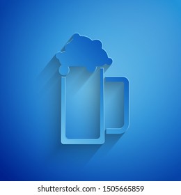 Paper cut Glass of beer icon isolated on blue background. Paper art style. Vector Illustration