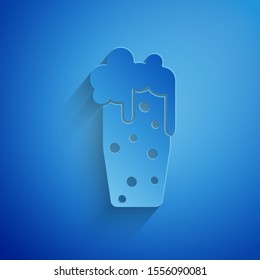 Paper cut Glass of beer icon isolated on blue background. Paper art style. Vector Illustration