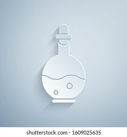 Paper cut Glass bottle with magic elixir icon isolated on grey background. Computer game asset. Paper art style. Vector Illustration