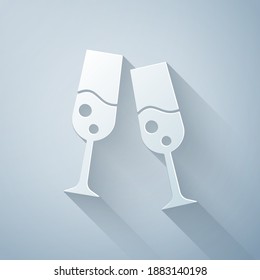 Paper cut Glass of champagne icon isolated on grey background. Merry Christmas and Happy New Year. Paper art style. Vector