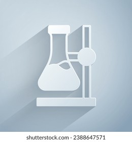 Paper cut Glass test tube flask on stand icon isolated on grey background. Laboratory equipment. Paper art style. Vector