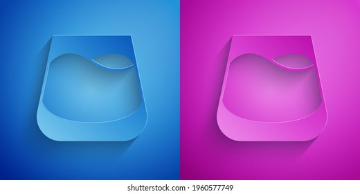 Paper cut Glass of whiskey icon isolated on blue and purple background. Paper art style. Vector