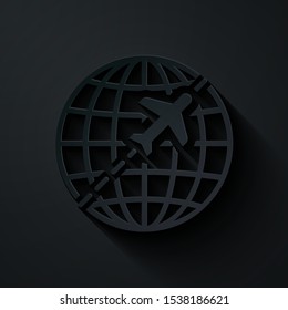 Paper cut Globe with flying plane icon isolated on black background. Airplane fly around the planet earth. Aircraft world icon. Paper art style. Vector Illustration