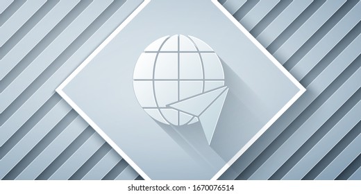 Paper cut Globe with flying plane icon isolated on grey background. Airplane fly around the planet earth. Aircraft world icon. Paper art style. Vector Illustration
