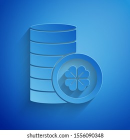 Paper cut Gold coin with four leaf clover icon isolated on blue background. Happy Saint Patricks day. Paper art style. Vector Illustration
