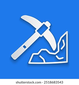 Paper cut Gold mining icon isolated on blue background. Paper art style. Vector