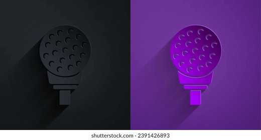 Paper cut Golf ball on tee icon isolated on black on purple background. Paper art style. Vector