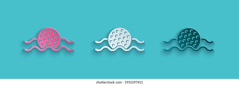 Paper cut Golf ball in water icon isolated on blue background. Paper art style. Vector