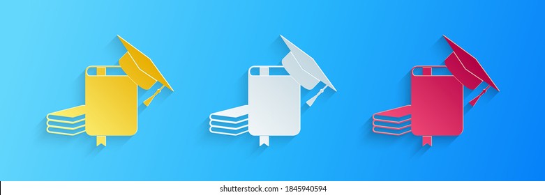 Paper cut Graduation cap and book icon isolated on blue background. Paper art style. Vector.