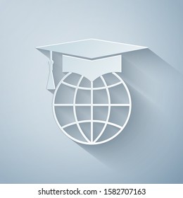 Paper cut Graduation cap on globe icon isolated on grey background. World education symbol. Online learning or e-learning concept. Paper art style. Vector Illustration