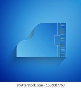 Paper cut Grand piano icon isolated on blue background. Musical instrument. Paper art style. Vector Illustration