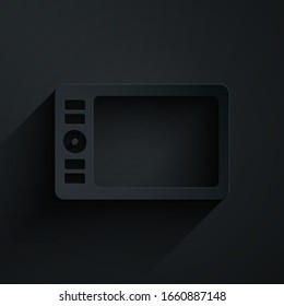 Paper cut Graphic tablet icon isolated on black background. Paper art style. Vector Illustration