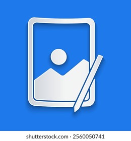 Paper cut Graphic tablet icon isolated on blue background. Paper art style. Vector Illustration