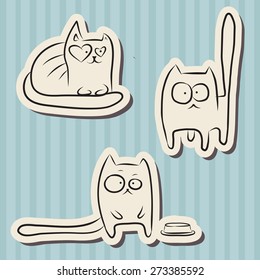 Paper cut hand drawn sketches of funny cats over blue vintage background.