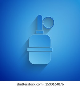 Paper cut Hand grenade icon isolated on blue background. Bomb explosion. Paper art style. Vector Illustration
