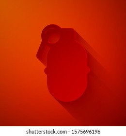 Paper cut Hand grenade icon isolated on red background. Bomb explosion. Paper art style. Vector Illustration