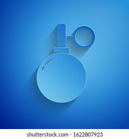 Paper cut Hand grenade icon isolated on blue background. Bomb explosion. Paper art style. Vector Illustration