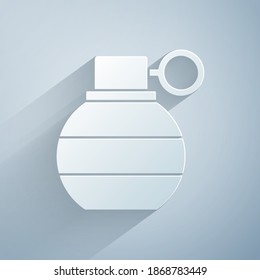 Paper cut Hand grenade icon isolated on grey background. Bomb explosion. Paper art style. Vector
