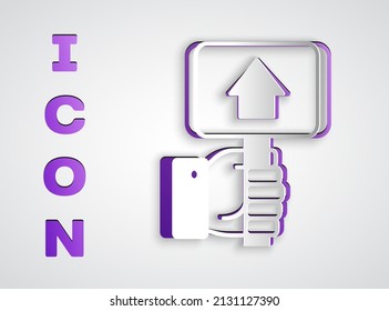 Paper cut Hand holding auction paddle icon isolated on grey background. Bidding concept. Auction competition. Hands rising signs with BID inscriptions. Paper art style. Vector