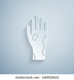 Paper cut Hand with psoriasis or eczema icon isolated on grey background. Concept of human skin response to allergen or chronic body problem. Paper art style. Vector Illustration