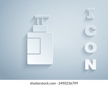 Paper cut Hand sanitizer bottle icon isolated on grey background. Disinfection concept. Washing gel. Alcohol bottle for hygiene. Paper art style. Vector