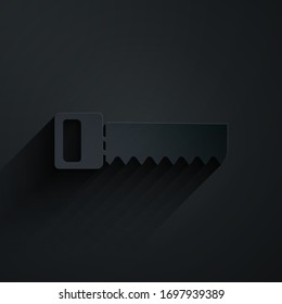 Paper cut Hand saw icon isolated on black background. Paper art style. Vector Illustration