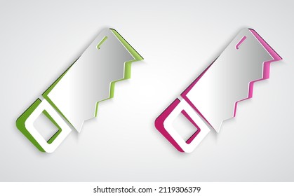 Paper cut Hand saw icon isolated on grey background. Paper art style. Vector