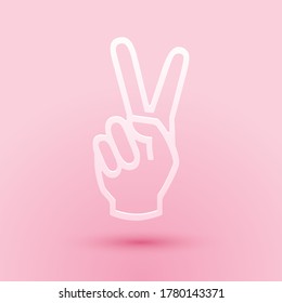 Paper cut Hand showing two finger icon isolated on pink background. Victory hand sign. Paper art style. Vector