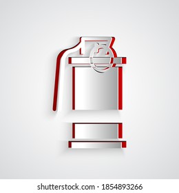 Paper cut Hand smoke grenade icon isolated on grey background. Bomb explosion. Paper art style. Vector
