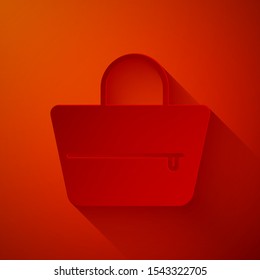 Paper cut Handbag icon isolated on red background. Female handbag sign. Glamour casual baggage symbol. Paper art style. Vector Illustration