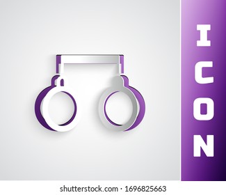 Paper cut Handcuffs icon isolated on grey background. Paper art style. Vector Illustration