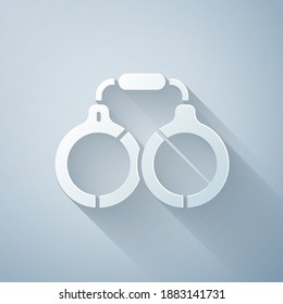 Paper cut Handcuffs icon isolated on grey background. Paper art style. Vector