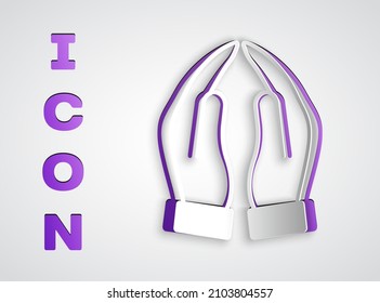 Paper cut Hands in praying position icon isolated on grey background. Prayer to god with faith and hope. Paper art style. Vector