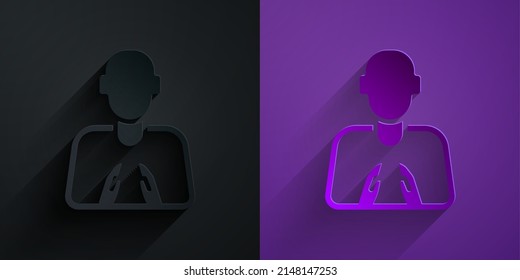 Paper cut Hands in praying position icon isolated on black on purple background. Prayer to god with faith and hope. Paper art style. Vector