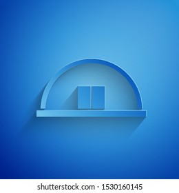 Paper cut Hangar icon isolated on blue background. Paper art style. Vector Illustration