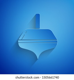 Paper cut Hanukkah dreidel icon isolated on blue background. Paper art style. Vector Illustration