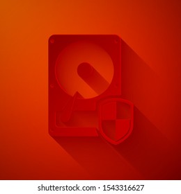 Paper cut Hard disk drive HDD protection icon isolated on red background. Paper art style. Vector Illustration