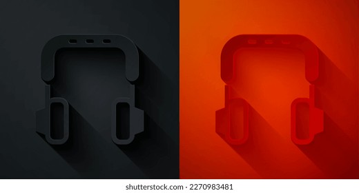 Paper cut Headphones icon isolated on black and red background. Earphones. Concept for listening to music, service, communication and operator. Paper art style. Vector