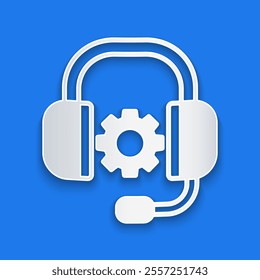 Paper cut Headphones icon isolated on blue background. Support customer service, hotline, call center, faq, maintenance. Paper art style. Vector
