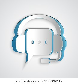 Paper cut Headphones with speech bubble icon isolated on grey background. Support customer services, hotline, call center, guideline, maintenance. Paper art style. Vector Illustration