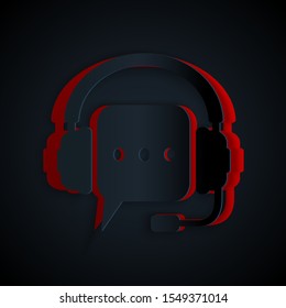 Paper cut Headphones with speech bubble icon isolated on black background. Support customer services, hotline, call center, guideline, maintenance. Paper art style. Vector Illustration