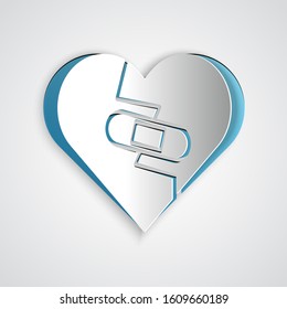 Paper cut Healed broken heart or divorce icon isolated on grey background. Shattered and patched heart. Love symbol. Valentines day. Paper art style. Vector Illustration